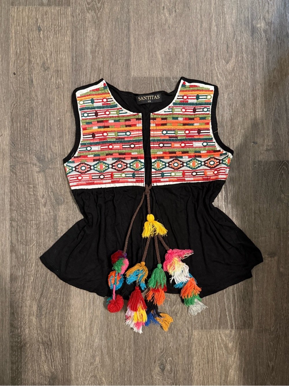 Black Embroidered Sleeveless Peplum Top with Multicolor Tassels